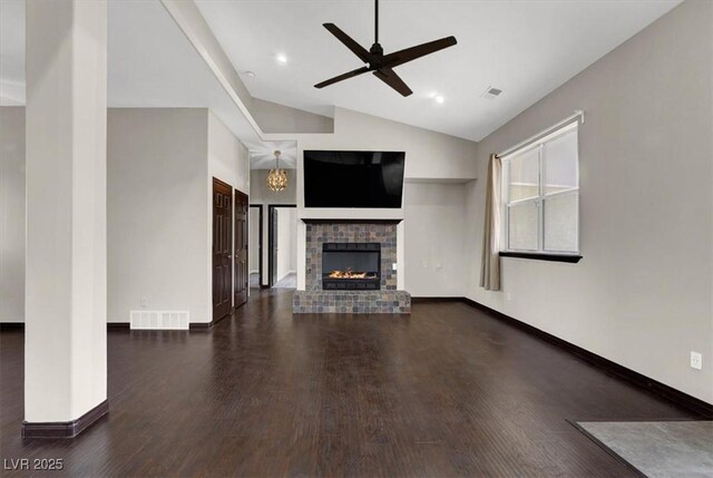 unfurnished living room with wood finished floors, a fireplace, and visible vents