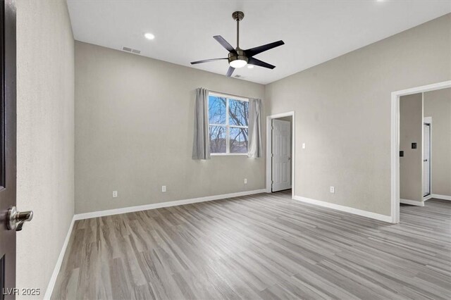 spare room featuring visible vents, wood finished floors, recessed lighting, baseboards, and ceiling fan