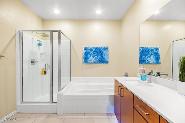 full bath with a garden tub, a stall shower, and vanity