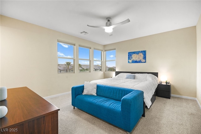 bedroom featuring visible vents, carpet flooring, baseboards, and ceiling fan