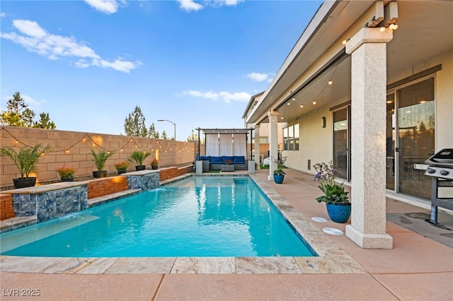 view of pool featuring outdoor lounge area, a patio area, a fenced backyard, and a fenced in pool