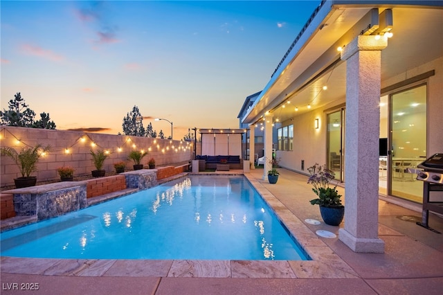 view of pool featuring an outdoor living space, a fenced in pool, a fenced backyard, and a patio area