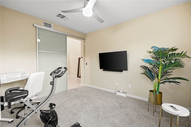 exercise room featuring visible vents, carpet flooring, baseboards, and ceiling fan