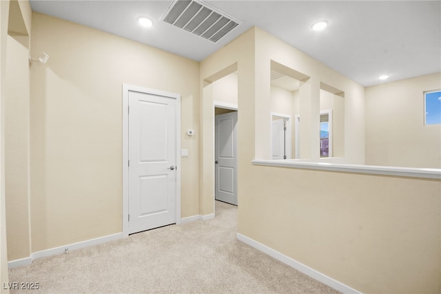 hallway featuring recessed lighting, visible vents, carpet floors, and baseboards