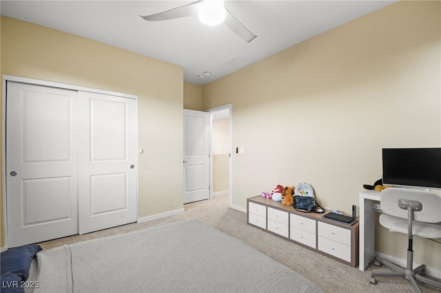 bedroom featuring carpet flooring, baseboards, a closet, and ceiling fan