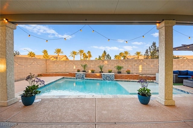 view of pool featuring a patio, a fenced backyard, and a fenced in pool