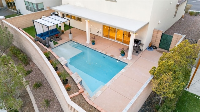 view of pool featuring a patio area, a fenced backyard, and a fenced in pool