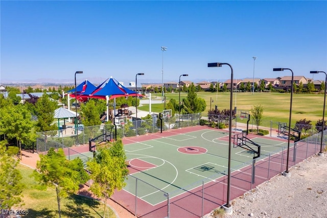 view of basketball court featuring community basketball court and fence