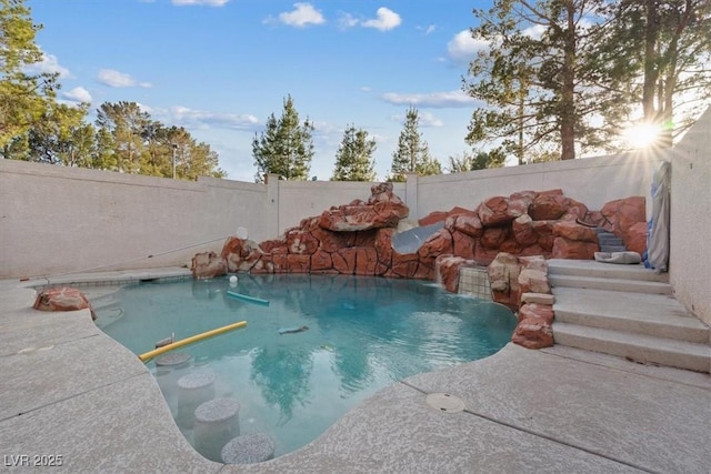 view of pool featuring a fenced in pool and a fenced backyard