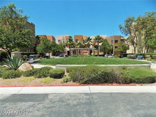 surrounding community featuring a residential view and a lawn