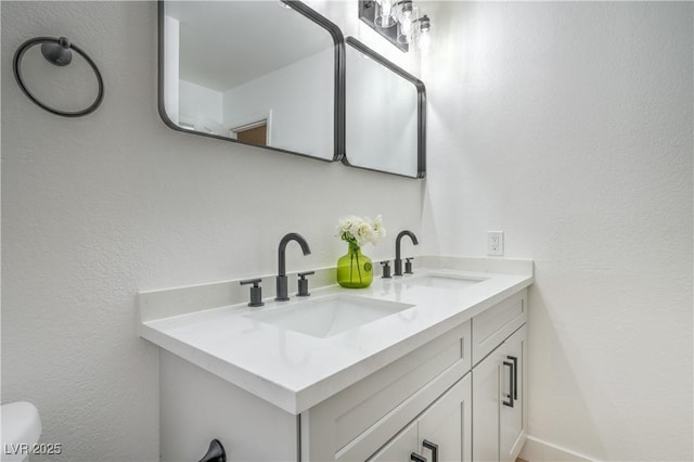 bathroom with double vanity and a sink