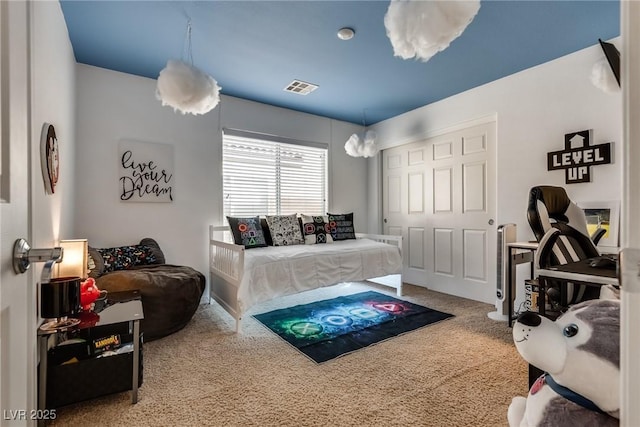 bedroom with carpet flooring and visible vents