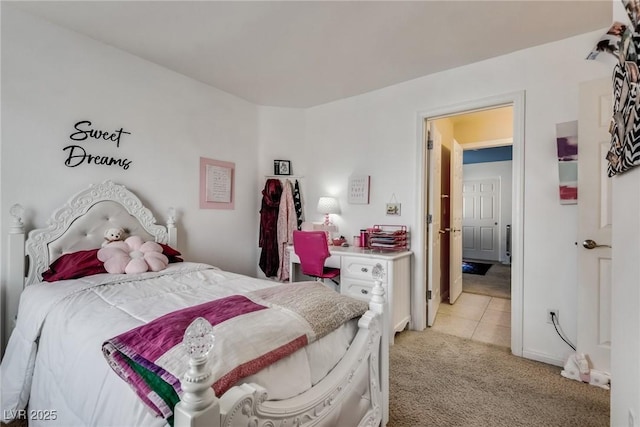 bedroom featuring light tile patterned floors and light colored carpet