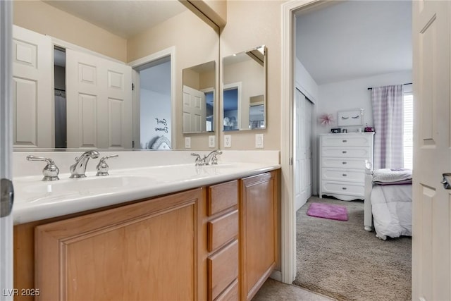 full bath featuring a sink, ensuite bath, and double vanity