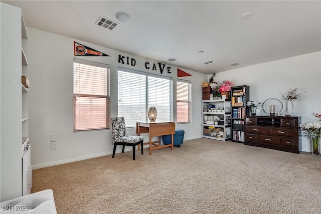 sitting room featuring visible vents, baseboards, and carpet