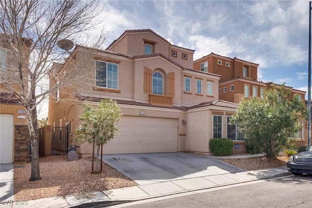 view of front of home featuring fence, driveway, stucco siding, a garage, and a tiled roof