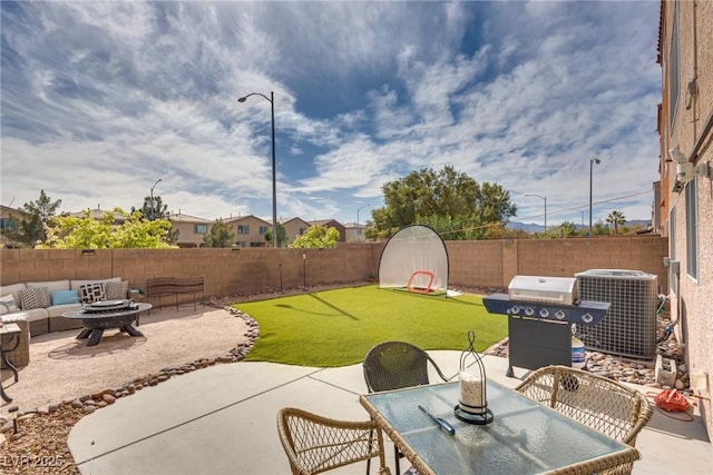 view of patio / terrace featuring area for grilling, cooling unit, a fenced backyard, and an outdoor fire pit