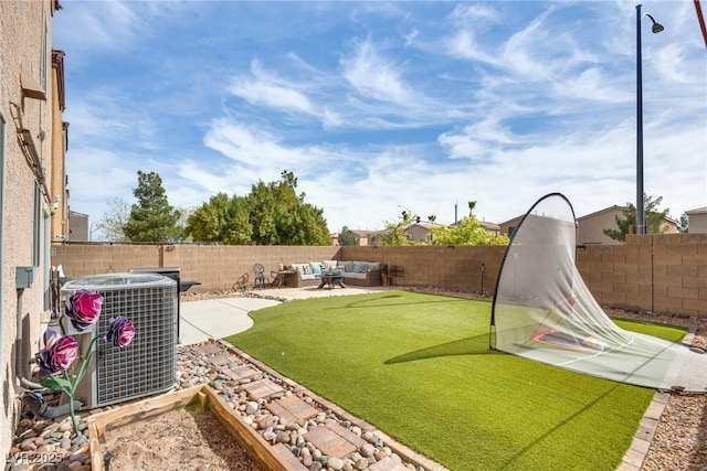 view of yard featuring a patio, a fenced backyard, central AC, and an outdoor hangout area