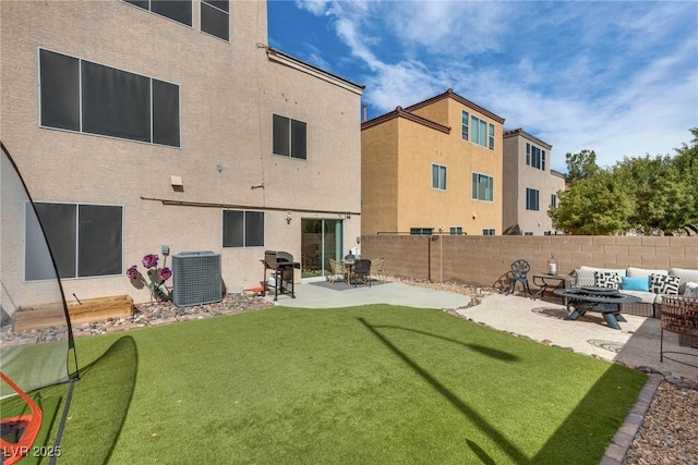 view of yard with an outdoor living space, central AC unit, a patio, and fence