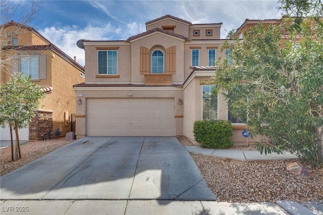 view of front of home featuring stucco siding, concrete driveway, an attached garage, and a tiled roof