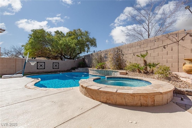 view of swimming pool with a patio, a fenced backyard, and a pool with connected hot tub