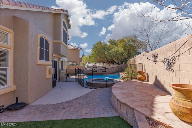 view of patio / terrace with a fenced in pool and a fenced backyard