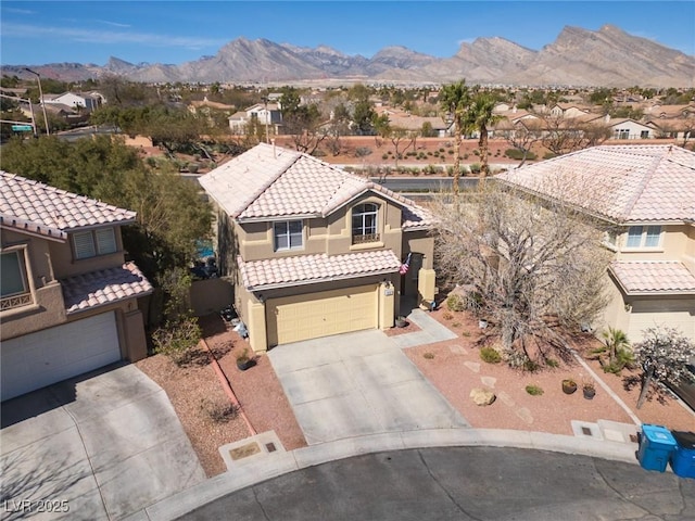 aerial view featuring a mountain view and a residential view