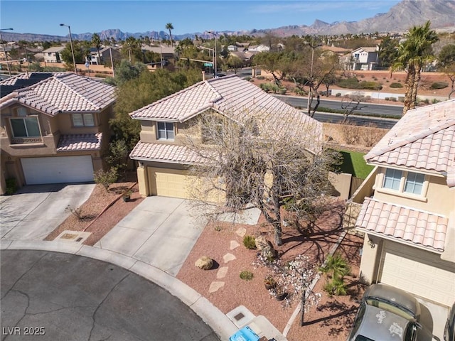 birds eye view of property featuring a mountain view and a residential view