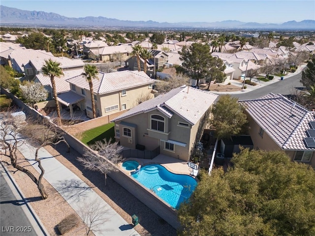 drone / aerial view featuring a mountain view and a residential view