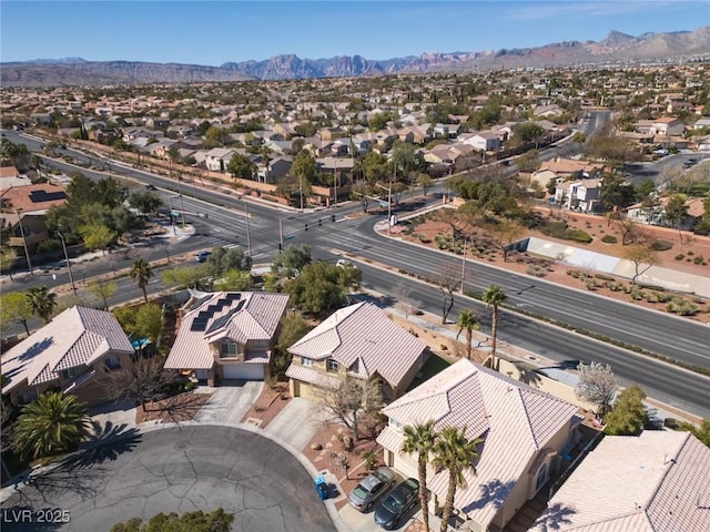 birds eye view of property with a residential view and a mountain view