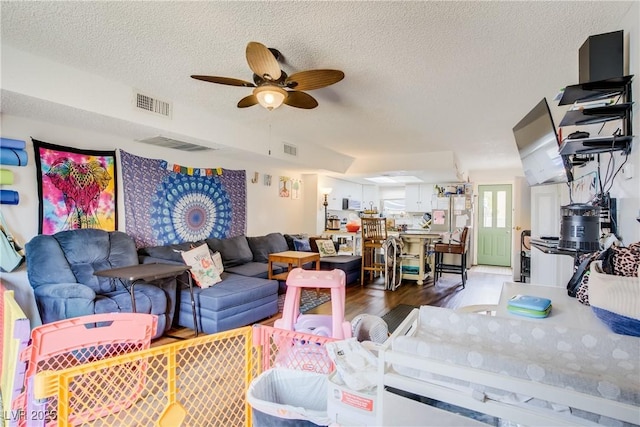 5706 W Lake Mead Blvd, Las Vegas, NV 89108 - living area featuring ceiling fan, wood finished floors, and a textured ceiling