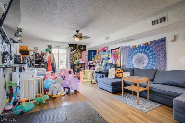 5706 W Lake Mead Blvd, Las Vegas, NV 89108 - living room with ceiling fan, wood finished floors, and a textured ceiling