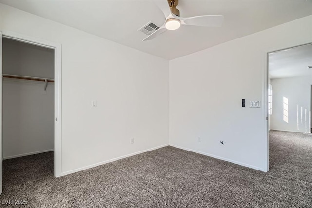 unfurnished bedroom with visible vents, carpet floors, baseboards, and a closet