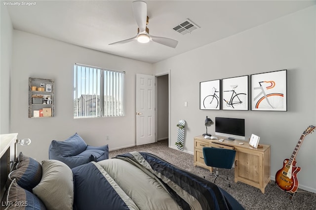 carpeted bedroom with visible vents, a ceiling fan, and baseboards