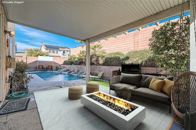 view of patio / terrace featuring an outdoor living space with a fire pit, a fenced backyard, and a fenced in pool