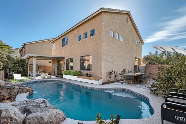 view of swimming pool featuring a fenced in pool, fence, and a patio area