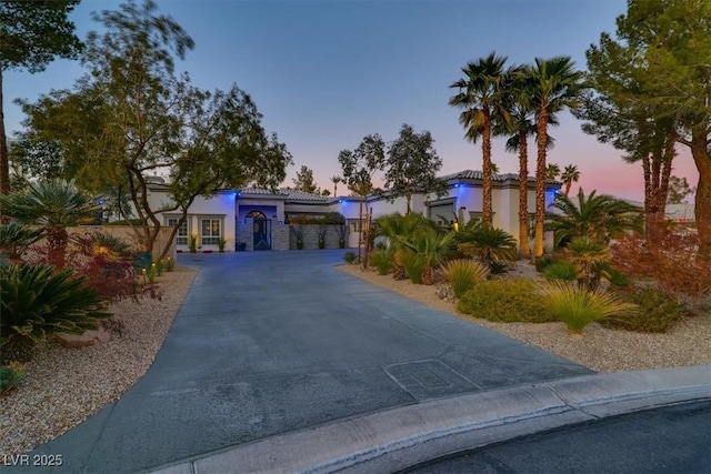 view of front of house with driveway and stucco siding