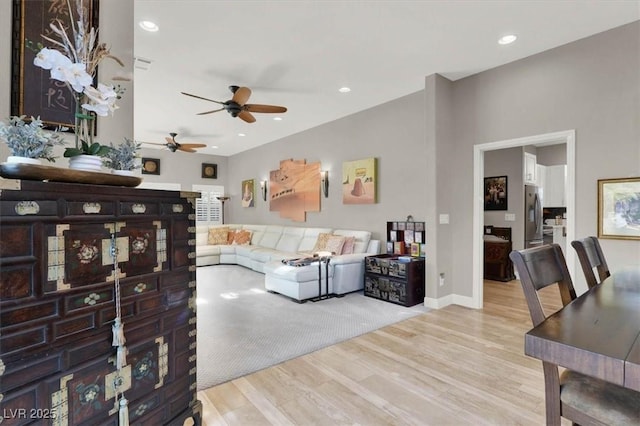 living area featuring visible vents, recessed lighting, a ceiling fan, and wood finished floors