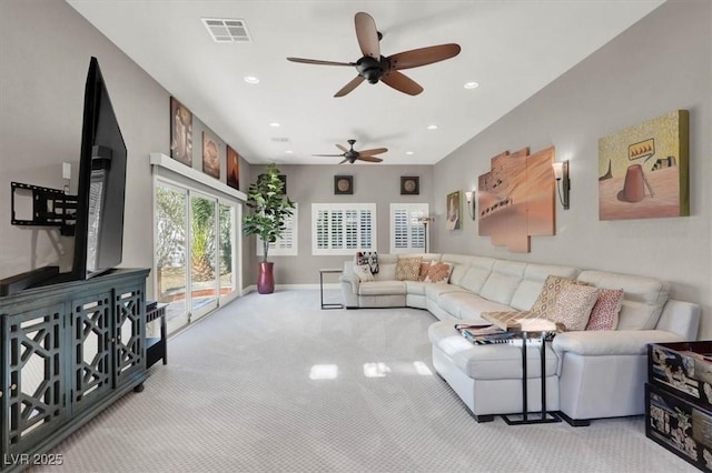 carpeted living room with recessed lighting, visible vents, and baseboards