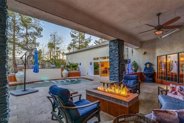 view of patio / terrace with an outdoor pool, an outdoor living space with a fire pit, and a ceiling fan