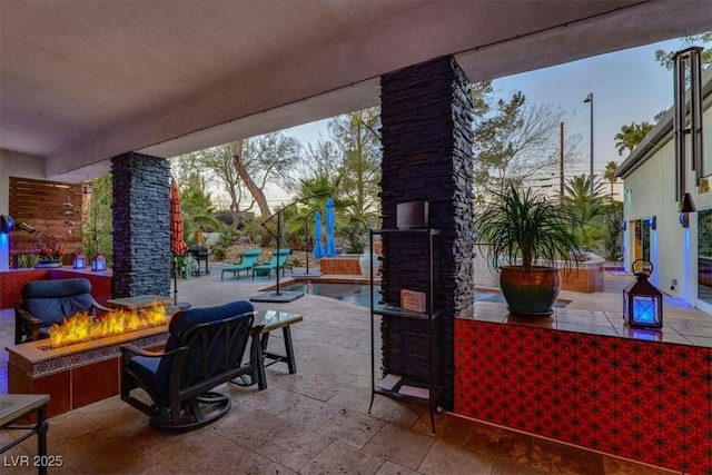 view of patio featuring an outdoor fire pit