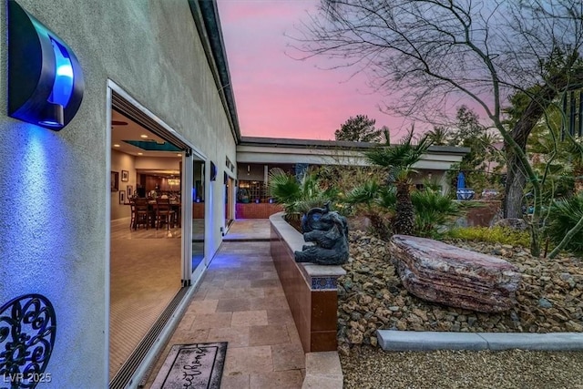 view of patio terrace at dusk