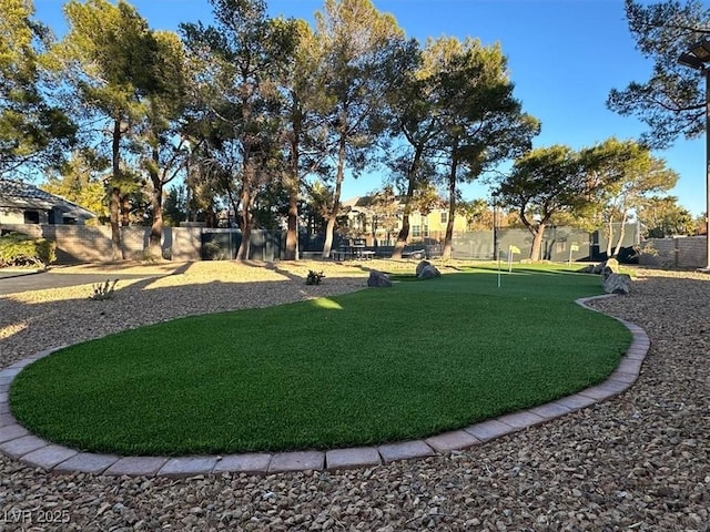 view of property's community featuring fence