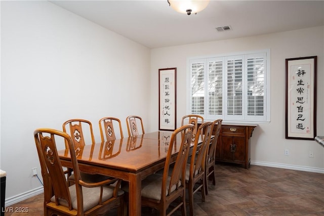 dining room with visible vents and baseboards