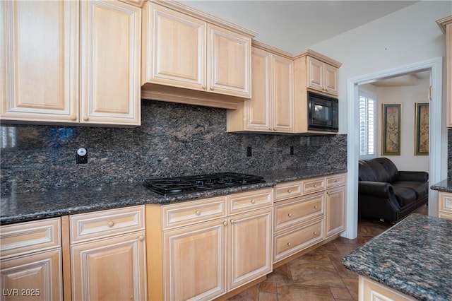 kitchen featuring black appliances, tasteful backsplash, and light brown cabinetry