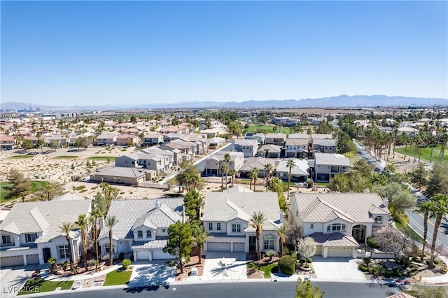 birds eye view of property with a mountain view and a residential view