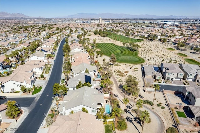 birds eye view of property featuring view of golf course, a mountain view, and a residential view