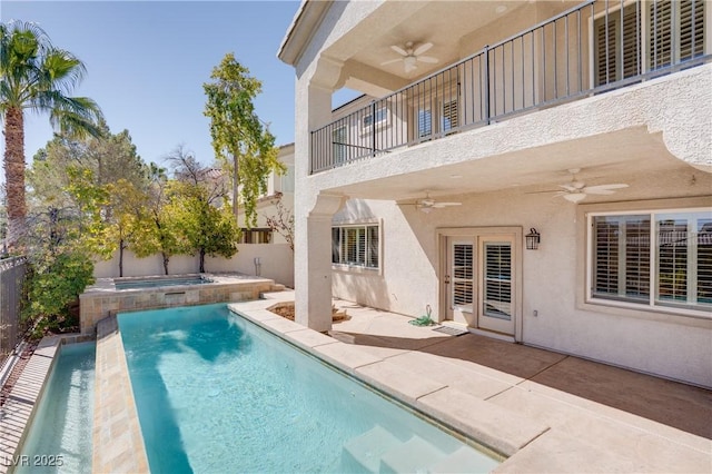 view of swimming pool with a fenced in pool, ceiling fan, a fenced backyard, a patio area, and an in ground hot tub