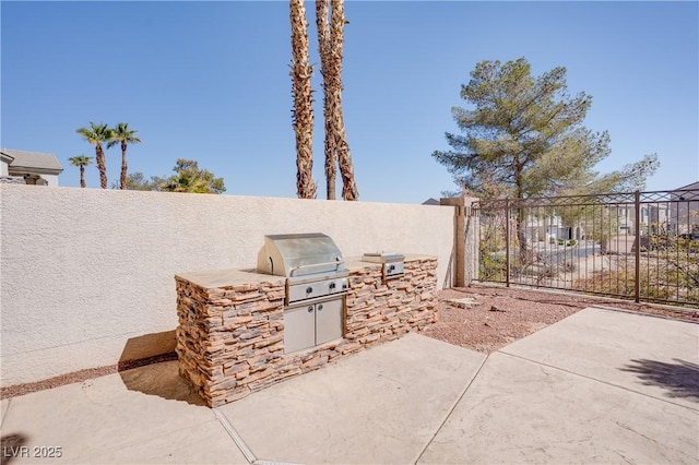 view of patio / terrace featuring area for grilling and fence