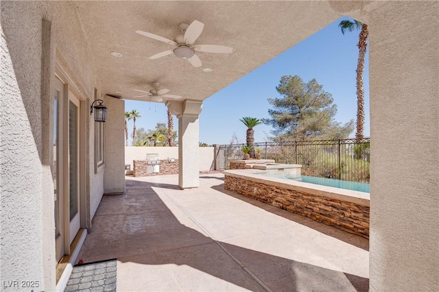 view of patio featuring ceiling fan and a fenced backyard